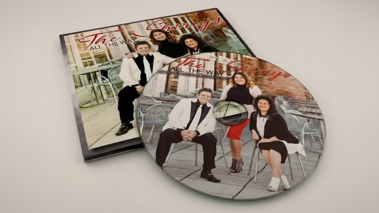 Two vinyl records with a family photo design on a white surface