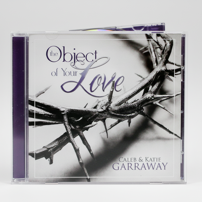 A jewel case containing a CD with a black and white image of thorns and the title 'Object of Your Love' by Caleb & Katie Garraway displayed on the cover.