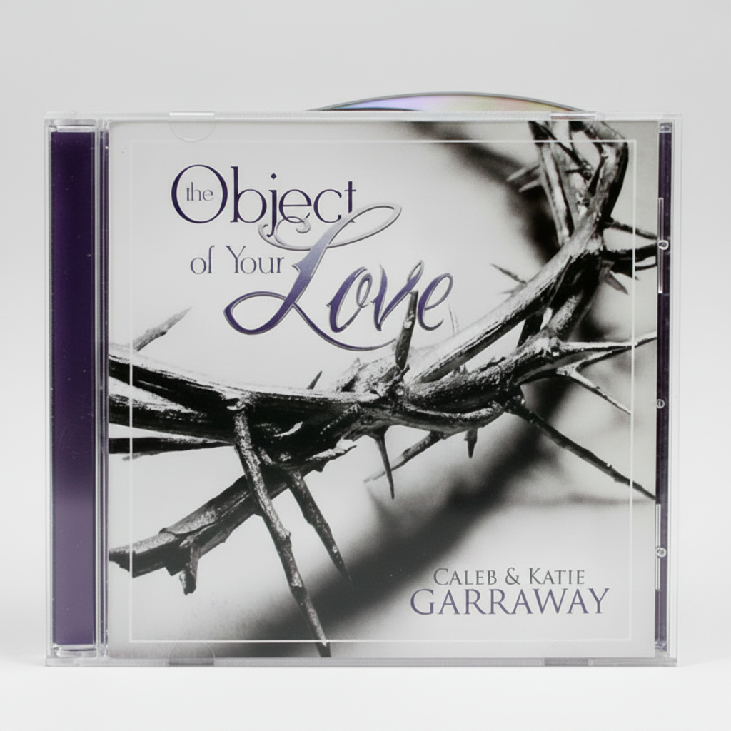 A jewel case containing a CD with a black and white image of thorns and the title 'Object of Your Love' by Caleb & Katie Garraway displayed on the cover.